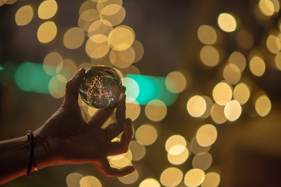 Hand Holding a Crystal Ball.